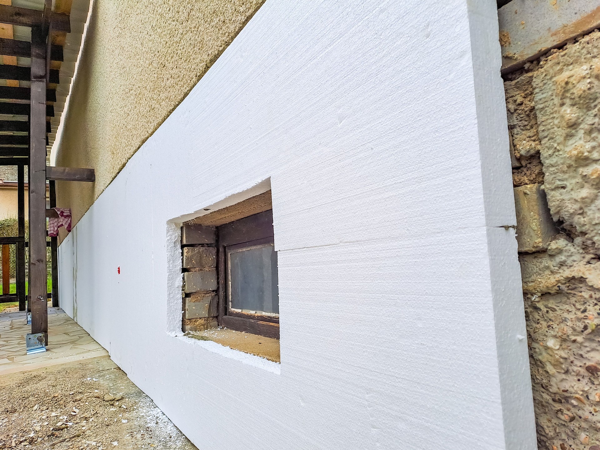 installing rigid styrofoam insulation board for energy saving of the house wall